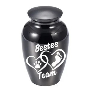 Close-up of black pet cremation urn with Bestes Team heart design