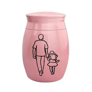 Detailansicht der rosa Gedenkurne mit Vater-und-Tochter-Strichzeichnung