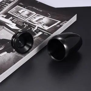 Minimalist glossy black egg-shaped memorial funeral urn for pet or human ashes