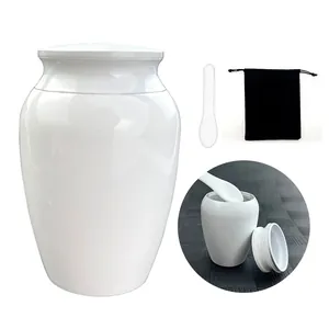 Minimalist small white ceramic cremation urn keepsake jar set with spoon and velvet storage bag