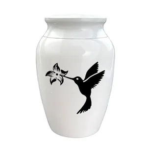 Urna blanca para mascotas con diseño de silueta de colibrí y flor en negro decorativo