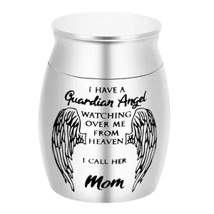 Silver stainless steel memorial urn engraved with guardian angel wings and Mom quote.