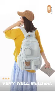 Stylish Korean style light blue padded backpack with multiple pockets and cute bear detail