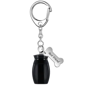Close-up detail of black memorial urn keychain with engraved Best Friend bone tag