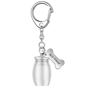 High quality detail view of silver pet urn keychain with Best Friend engraved bone charm