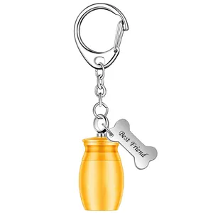 Golden pet cremation urn keychain featuring an engraved Best Friend bone charm detail
