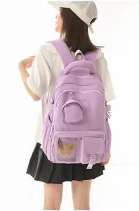 Rear view of a purple Korean-style school backpack worn by a stylish female model.