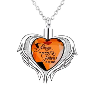 Detailed view of silver heart wings memorial urn pendant with Always on my mind text