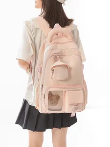 Zaino scolastico rosa pesca in stile coreano con manico imbottito e orsetto.