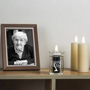 Crystal memorial urn candle holder with tree of life design and sentimental quote.