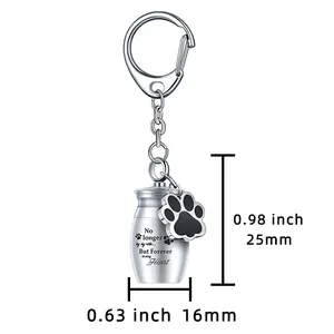Llavero de urna conmemorativa para mascotas con grabado y dije de huella de perro