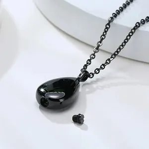 Black stainless steel teardrop cremation urn necklace showing bottom opening detail