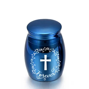 Pequeña urna conmemorativa de metal azul para cenizas humanas o de mascotas con cruz