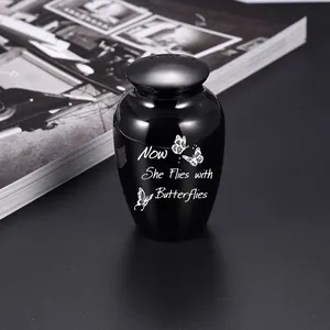 Small black memorial cremation urn for human or pet ashes with butterfly engraving
