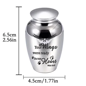 Polished alloy pet cremation urn with wings and heart engraving 6.5x4.5cm.