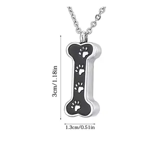 Detailed view showing bone-shaped cremation pendant dimensions: 1.3cm by 3cm