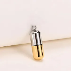 Minimalist two-tone gold and silver capsule pendant made of 316L stainless steel.