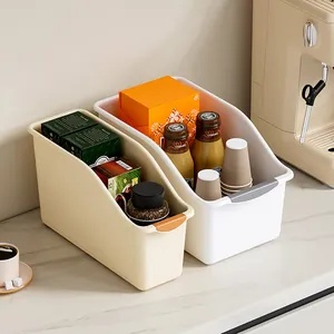 Set of minimalist plastic kitchen storage bins with handles and rollers on counter