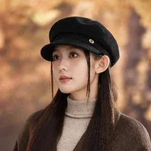 Classic black wool newsboy cap for women featuring a vintage British style and elegant fit