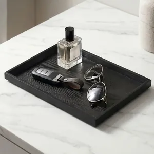 Elegant black wooden rectangular tray for home storage and decor on marble surface