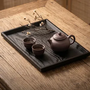Premium rectangular black wooden tea tray with natural grain texture in a lifestyle setting