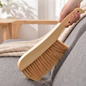 Ergonomic handheld wooden bed brush with soft bristles for dusting bedsheets and sofas