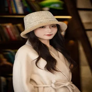 Model wearing a vintage jacquard suede bucket hat with soft lamb velvet lining.