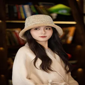 Elegant lady wearing a beige jacquard suede bucket hat with cozy lamb wool lining