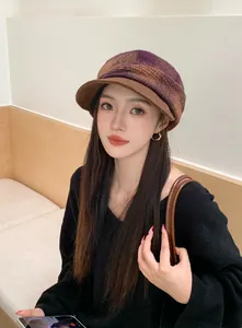 Stylish vintage plaid wool newsboy cap for women shown in a cozy indoor lifestyle setting