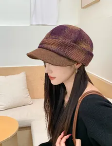 Side view of woman wearing a retro purple plaid wool newsboy cap for autumn and winter.