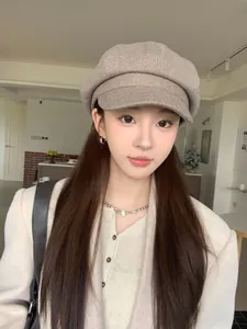Vintage British style solid beige newsboy cap for women in a natural lifestyle setting