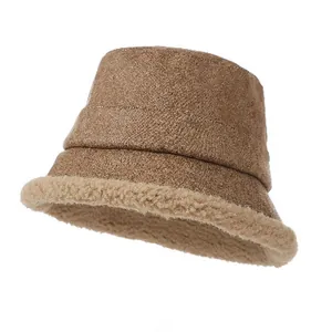 Close-up detail of vintage jacquard suede bucket hat with warm sherpa fleece lining.