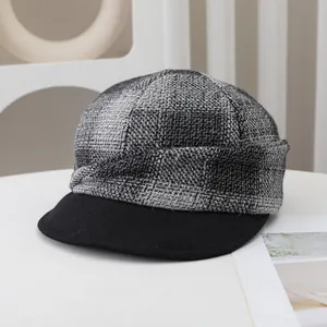 Close-up of vintage grey checkered wool newsboy hat for women in autumn