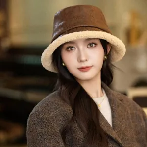 Vintage brown suede bucket hat with beige lamb wool lining for winter warmth and style