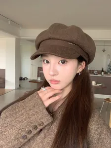 Classic brown wool-like British style newsboy cap with wide brim and metal detail for women