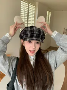 Sweet plaid newsboy cap featuring plush rabbit ears and delicate bow accents