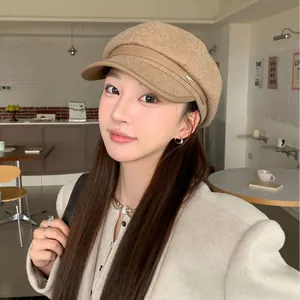 Chic beige wool newsboy hat with leather trim for women, trendy vintage autumn winter style.