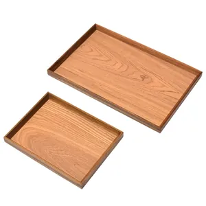 Two rectangular natural wooden serving trays for elegant tea and breakfast service