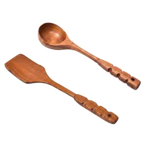Vintage wooden kitchen utensils set with carved handle spatula and soup ladle
