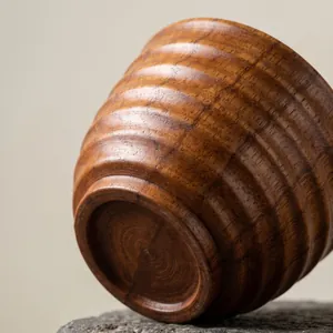 Natural jujube wood teacup with a retro ribbed texture and warm brown finish