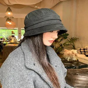 Close-up of black Korean style textured fisherman hat with layered band for autumn winter