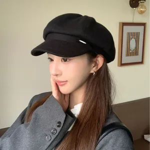Vintage British style solid black newsboy cap for women, elegant painter's hat on model