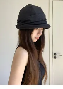 Detailed view of a black pleated bucket hat for women in casual Korean style.
