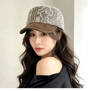 Detailed side view of a vintage embroidered newsboy cap worn by a stylish model