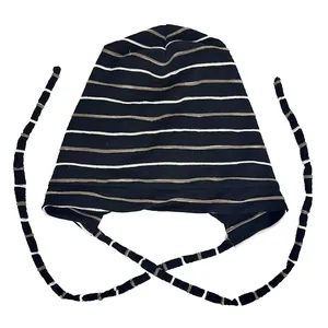 Detail view of the black and white horizontal stripes on a cotton chemo sleep cap