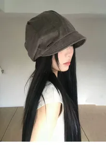 Side view of a vintage brown pleated newsboy hat with short brim for stylish women
