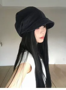 Detail shot of black vintage pleated newsboy hat for women with a slouchy design