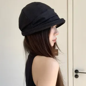 Elegant black pleated bucket hat for women in Korean style for spring and autumn.
