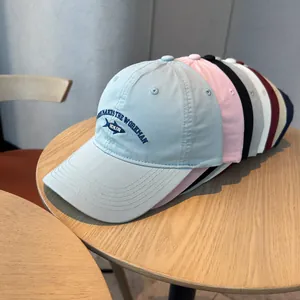 Vintage washed cotton baseball cap featuring fish embroidery available in multiple soft colors