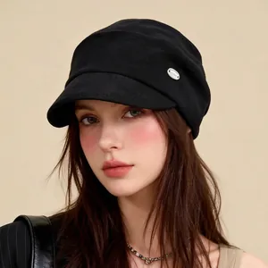 Vintage black newsboy hat for women with lazy casual style and metal detail